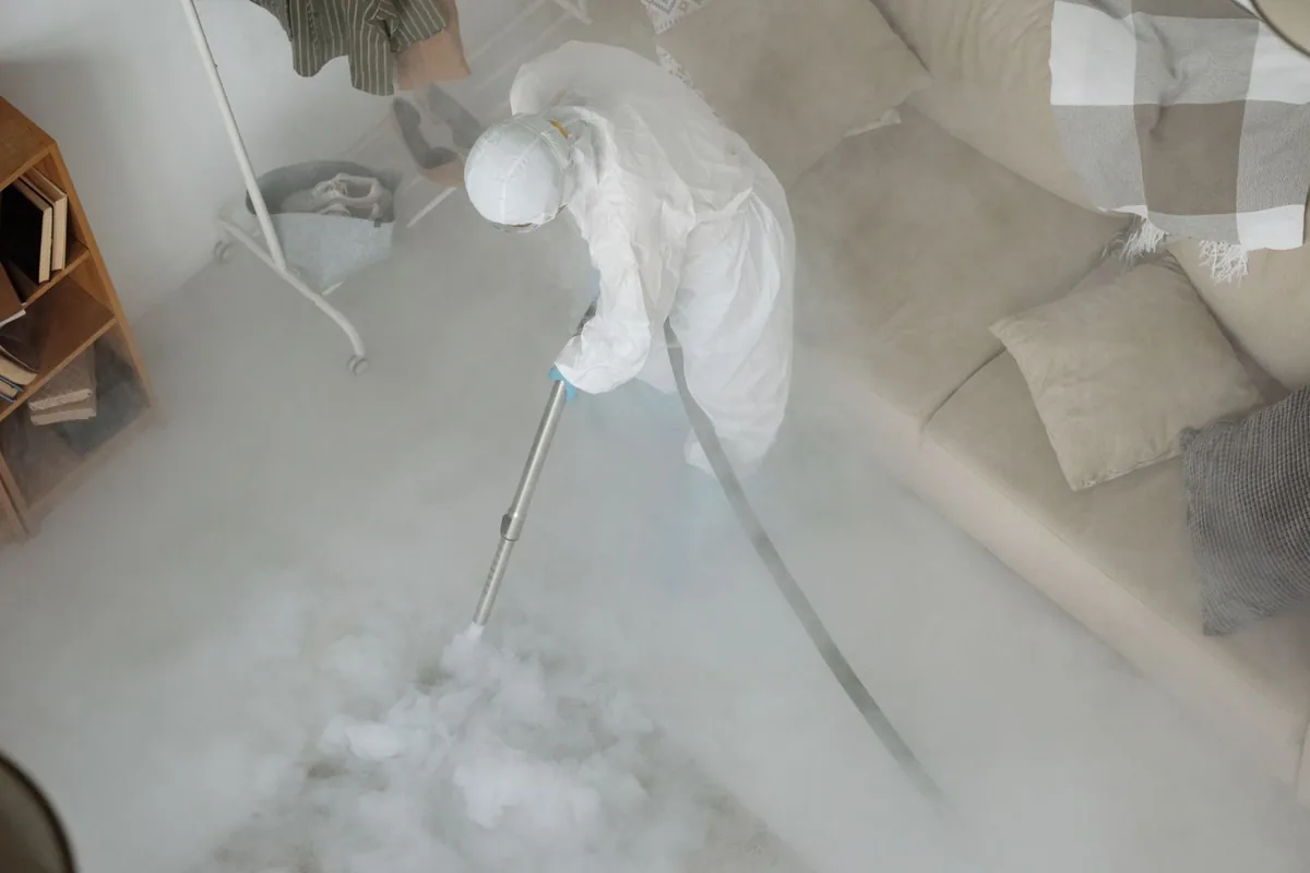 Biohazard cleanup technician in protective equipment, Fillmore, CA